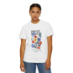 Person wearing a white t-shirt with floral design and text on a white background