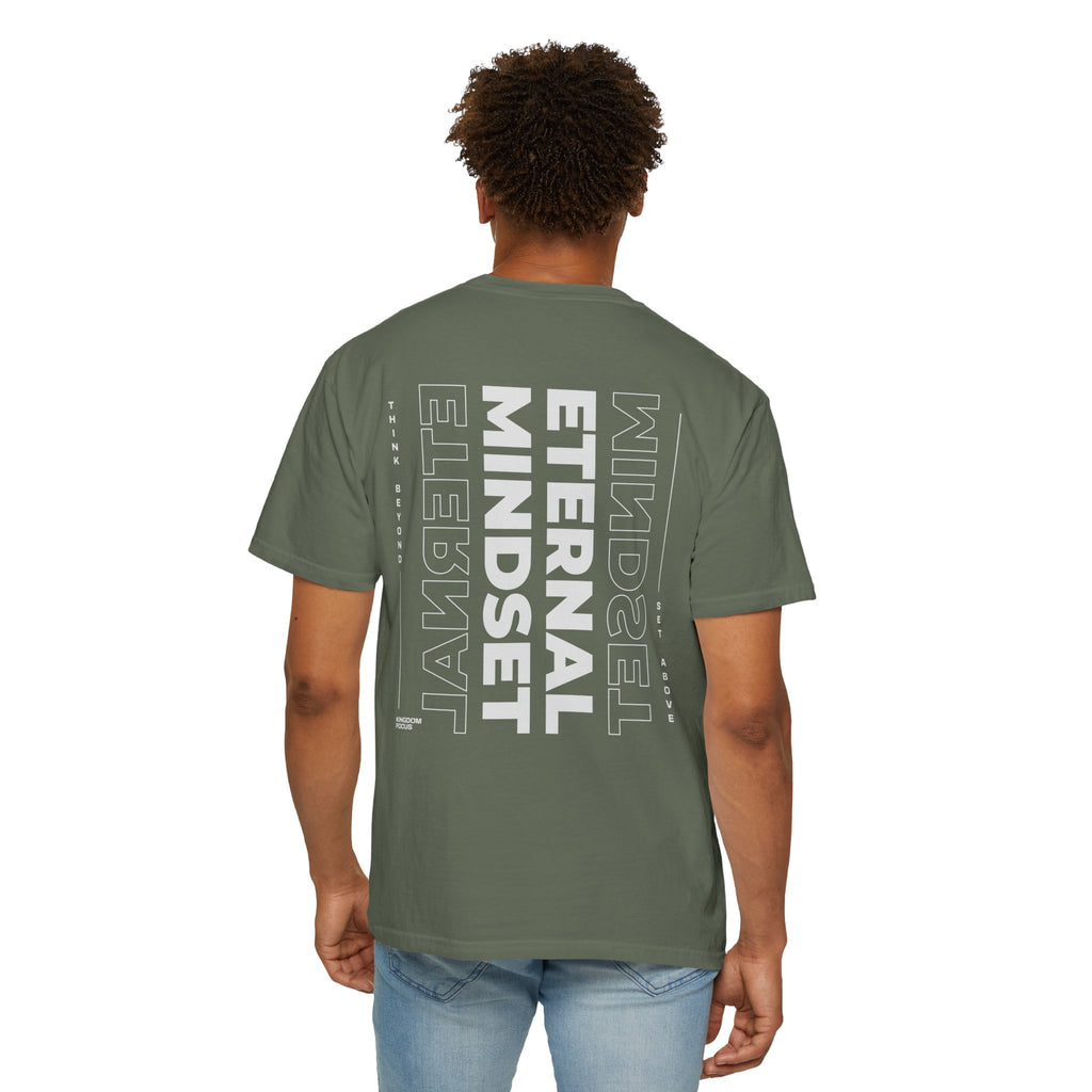 Person wearing a green t-shirt with 'Eternal Mindset' text on the back, standing against a white background.