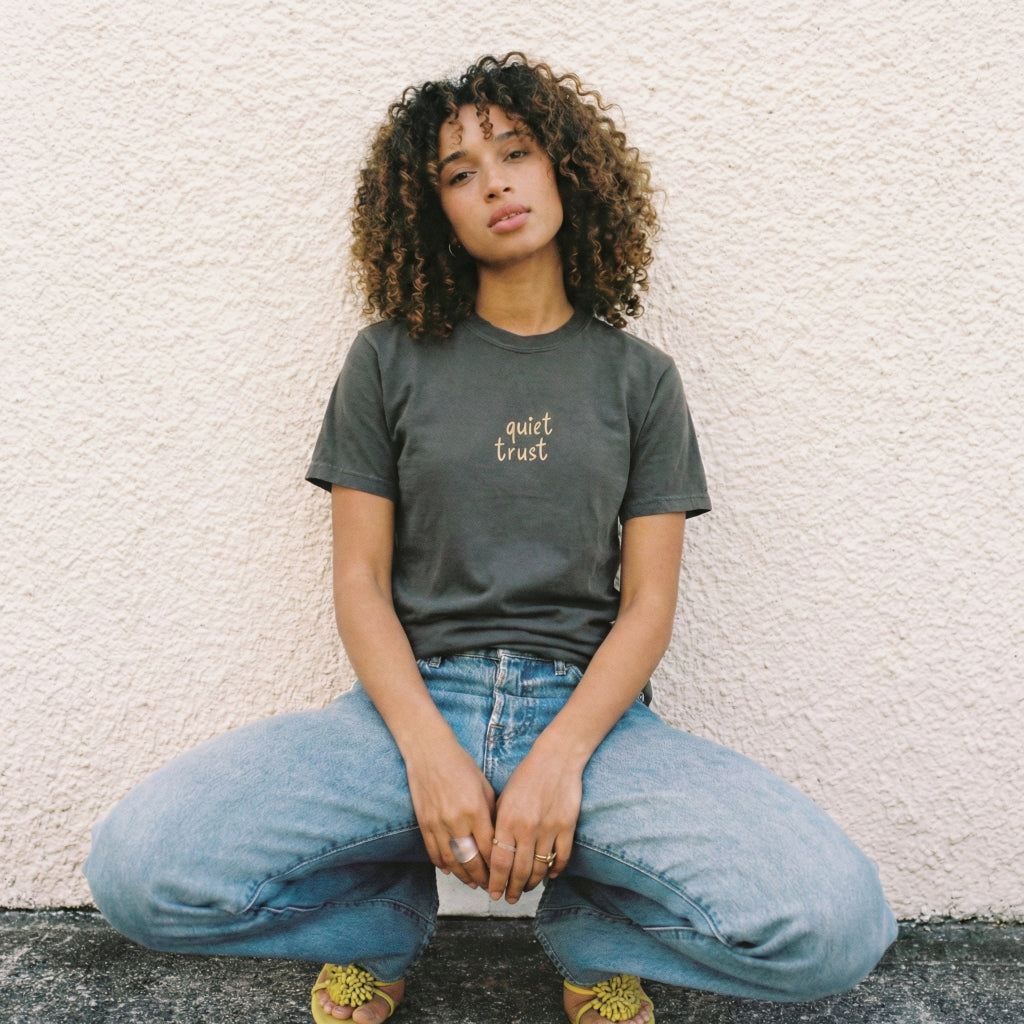 Close up of Quiet Trust t-shirt print showing hand-drawn waves and biblical surrender typography details