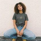 Close up of Quiet Trust t-shirt print showing hand-drawn waves and biblical surrender typography details