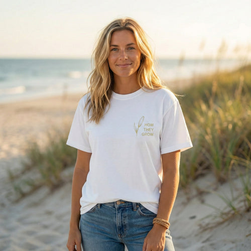 Woman wearing Consider The Lilies faith based unisex tee outdoors