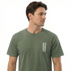 Man wearing a green t-shirt with 'Eternal Mindset' text on a white background