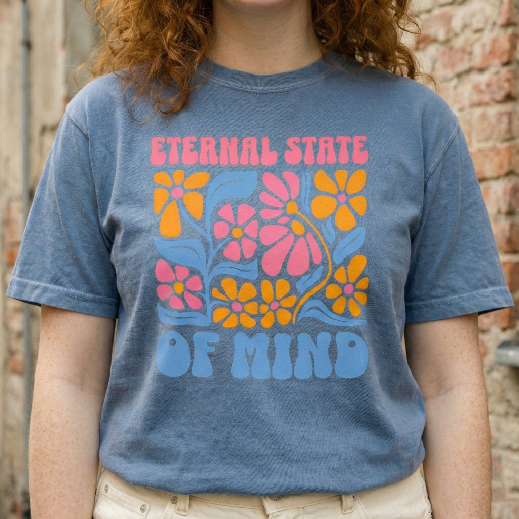 Woman wearing Eternal State of Mind faith based t-shirt in soft blue color