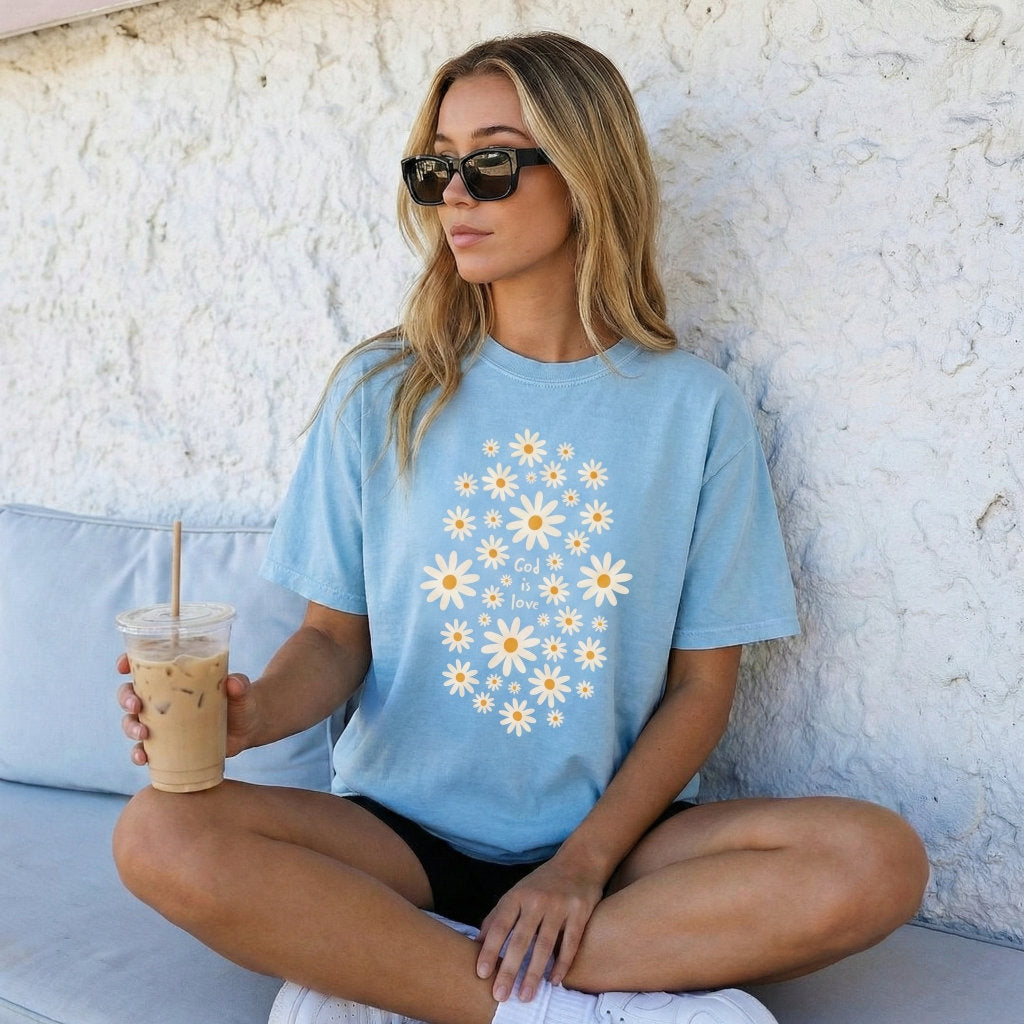God Is Love daisy floral Christian t-shirt front mockup on light blue unisex tee