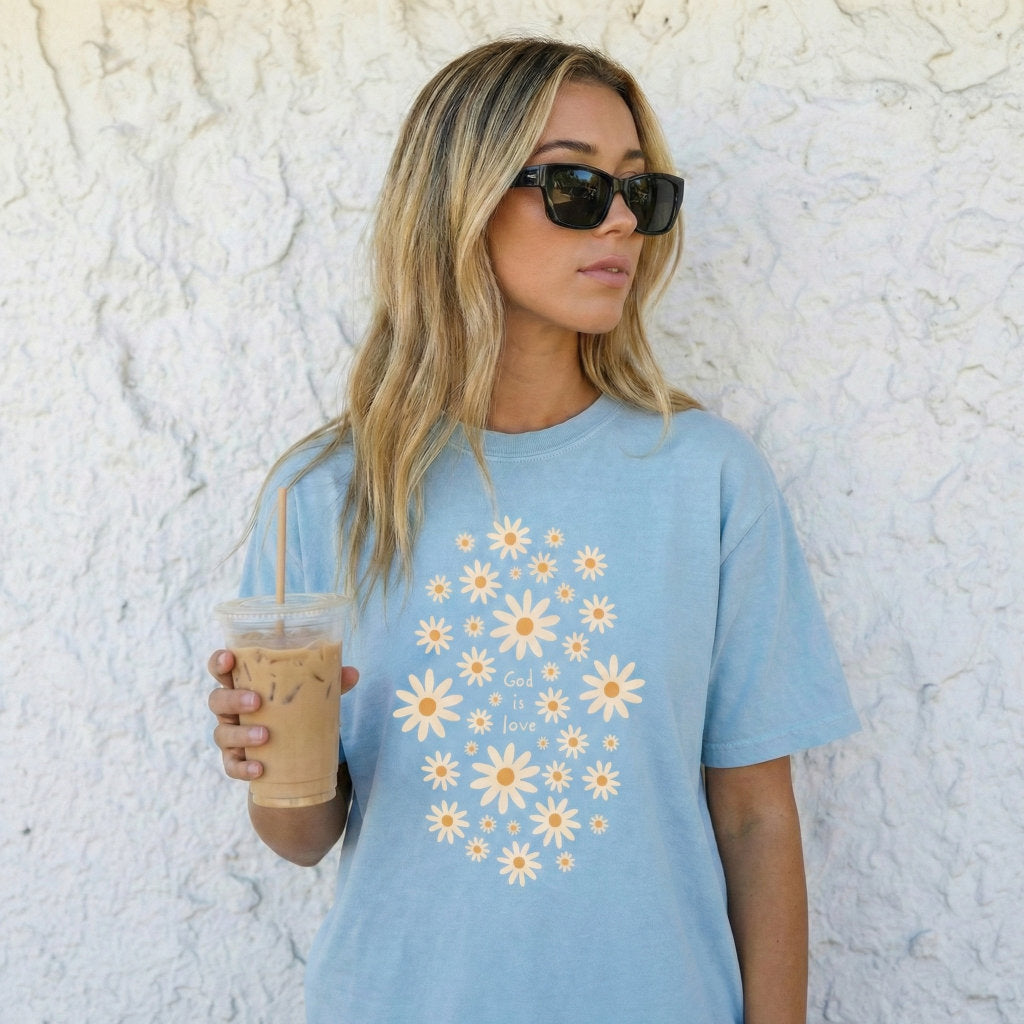 Christian God Is Love graphic tee with yellow and white daisy design