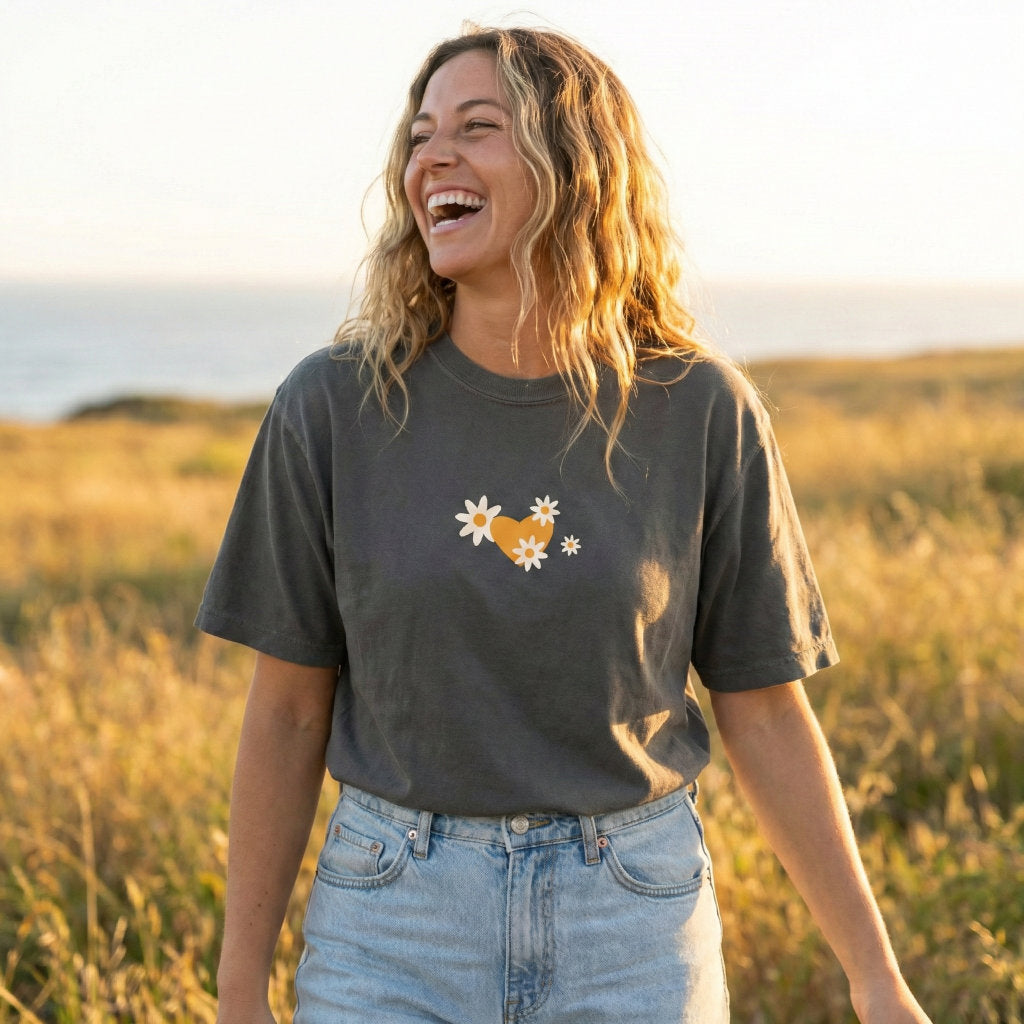 Woman wearing I Am Forgiven Christian t-shirt with floral back print and heart front design