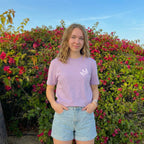 Female model wearing Jesus Is King Christian t-shirt front small crown design