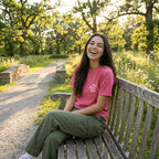 Love Never Fails unisex faith shirt pastel pink design close up