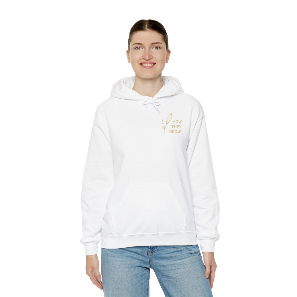 Person wearing a white hoodie with text on a white background