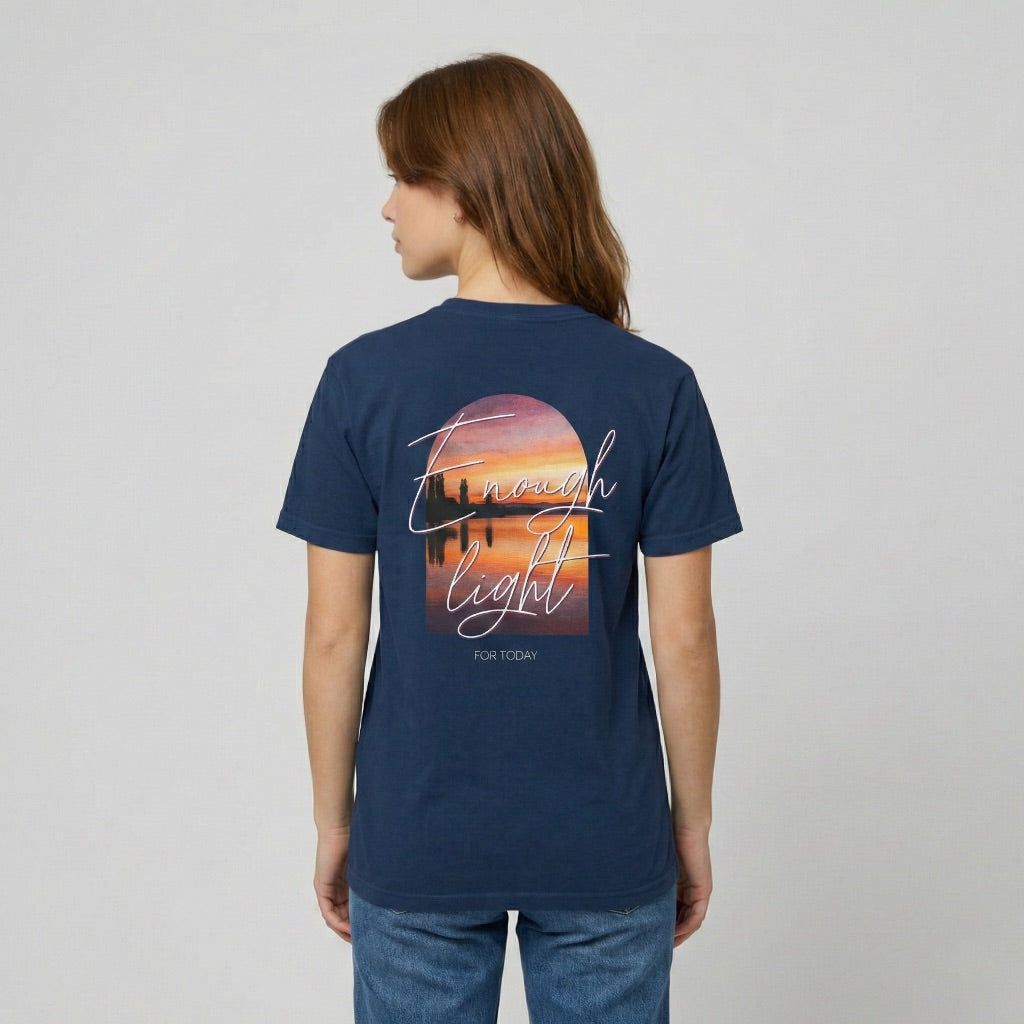 Detailed shot of the Enough Light For Today graphic highlighting the vibrant orange and purple sunset tones.