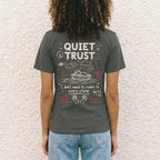 Back of charcoal Quiet Trust unisex t-shirt featuring Jesus sleeping in boat and I don't need to react to every storm text